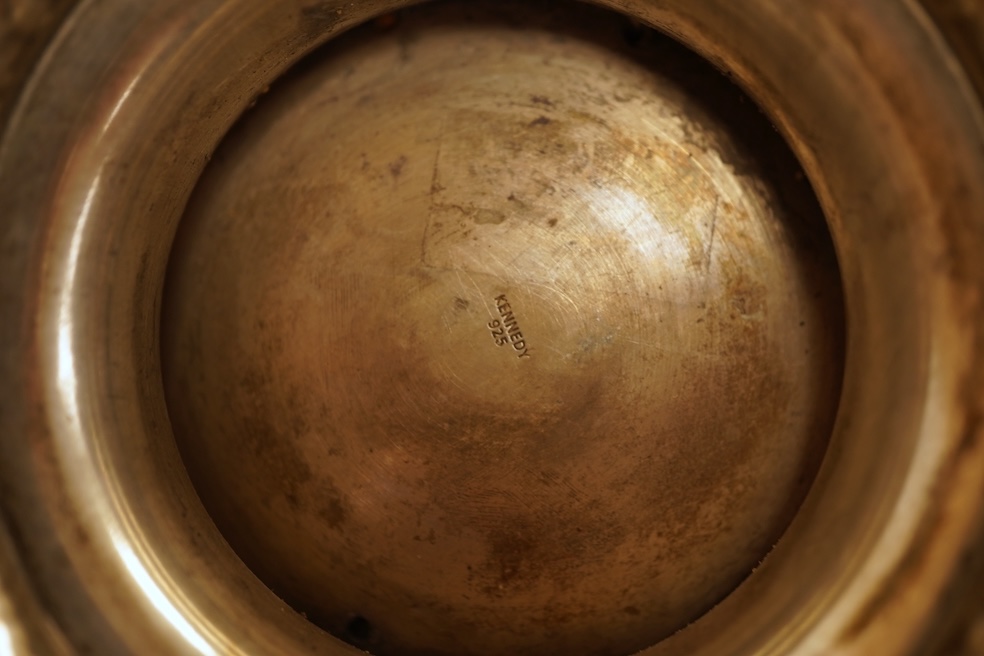 A hammered white metal two handled pedestal bowl, stamped 'Kennedy 925, diameter 18.9cm, 18.1oz.